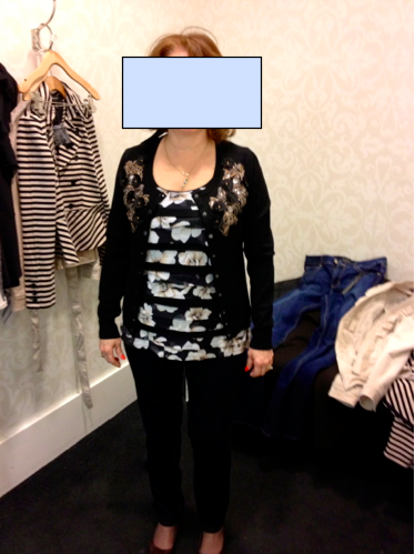 Tips: The paneling on this shirt masks the tummy while bringing attention to her whole self (not just one area). The material is light and the length—and inch or so past her hip—juuust right! The flower print is soft and not overbearing, which allows us to pair it with a bold/decoratively designed cardigan. Leave the cardigan open. The necklace is her own; remember we're trying things on here.  But it works. With so much pattern, you want everything else to be subdued. Add dark slim cut denim and the proportions work out well.