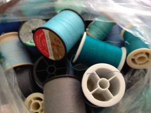 teal blue spool of thread