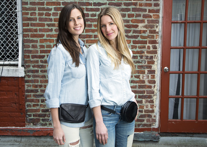 models posing outside in New York City with leather fanny packs
