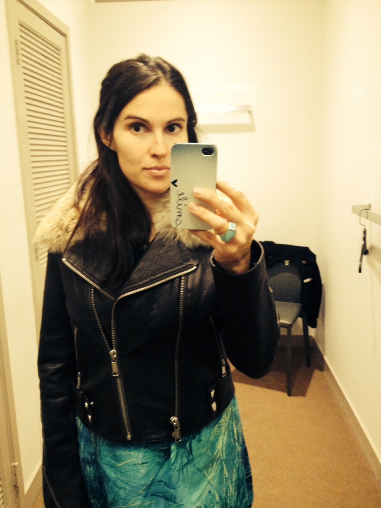 Lena Porter tries on a Andrew Marc x Richard Chai leather jacket for the Snapsure app